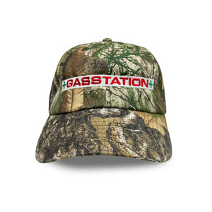 
                  
                    Gas station logo cap - real tree camo
                  
                